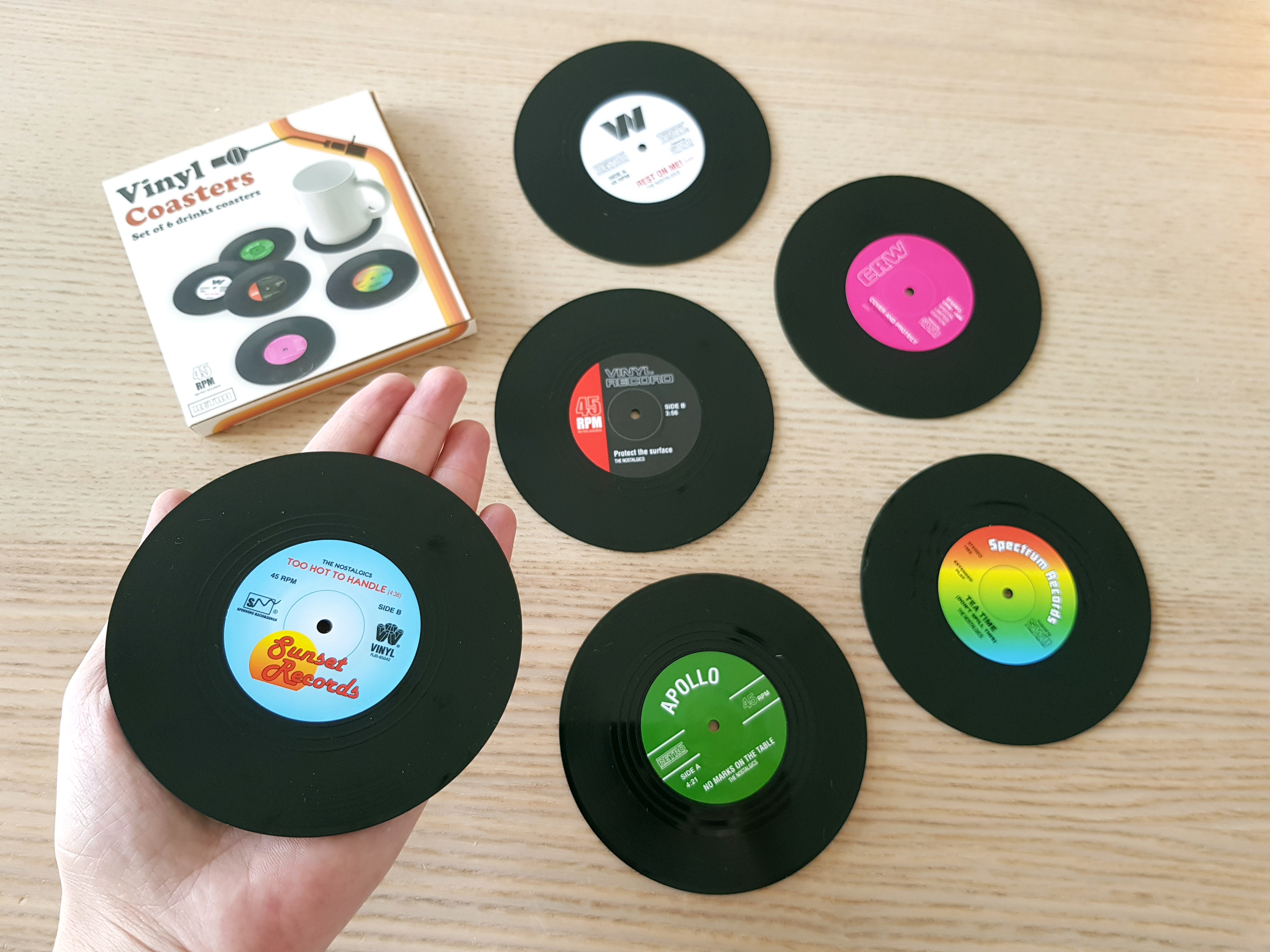 RETRO VINYL RECORDS COASTERS SET. A fun product taking care for your drinks not to spill and for your table not to get damaged.