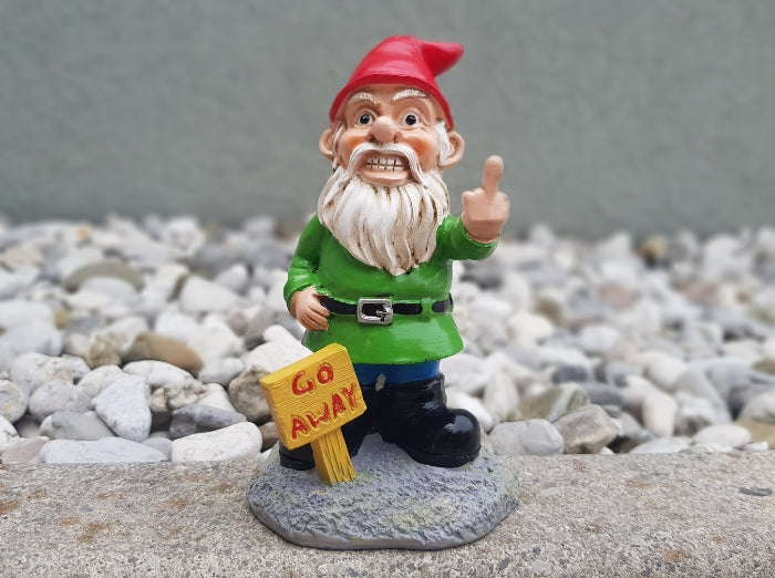 GO AWAY GARDEN GNOME. A fun product and a funny gift for garden decoration where the gnome is holding up the middle finger with a sign go away.