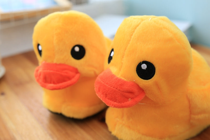 Plush duck slippers with open heel as a funny gift.